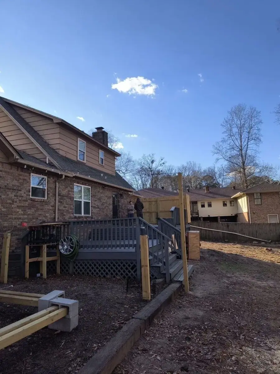 Cleared backyard with a rebuilt deck after tree removal in Arkadelphia, AR